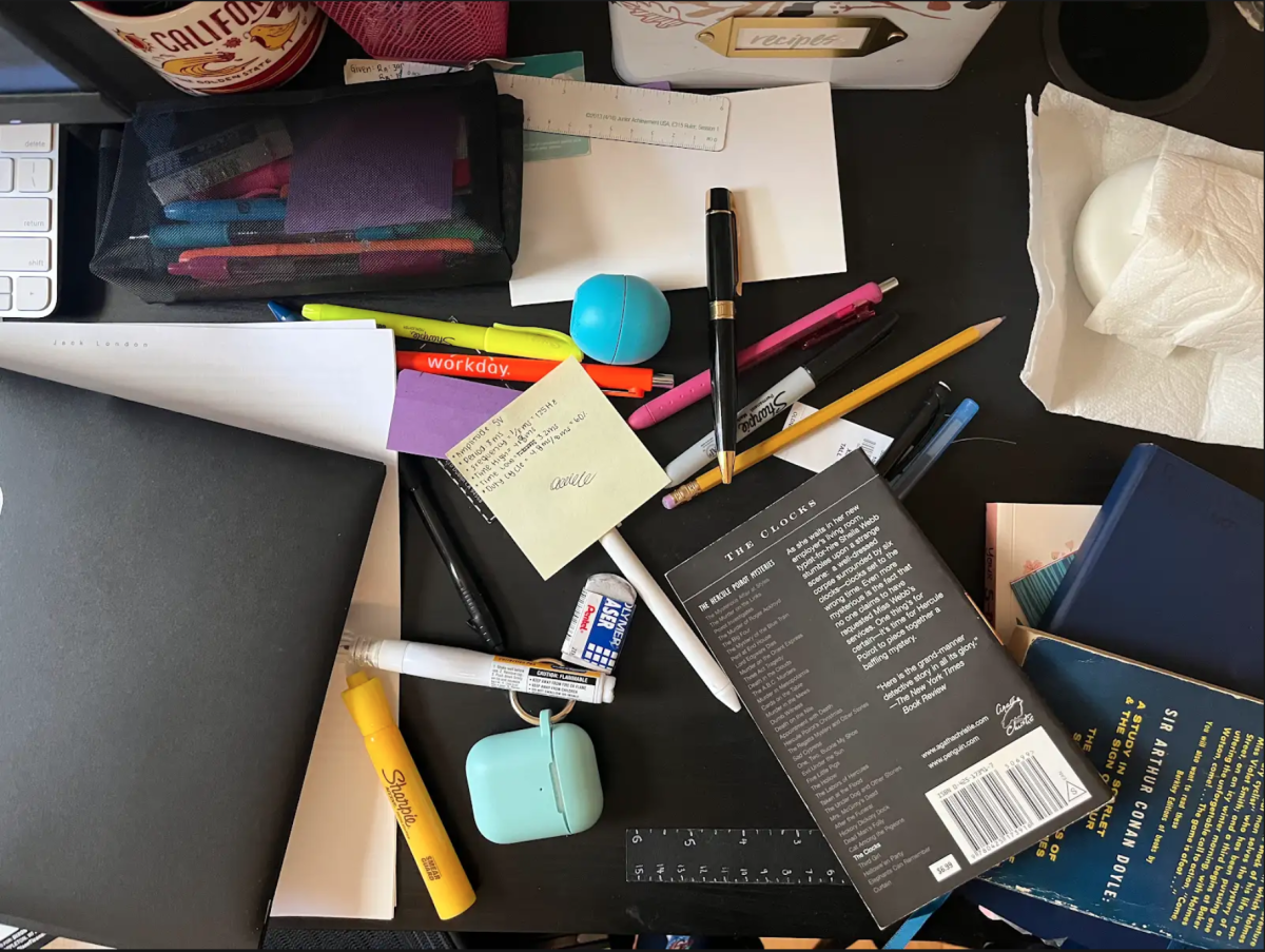 A scattered desk in need of decluttering. 